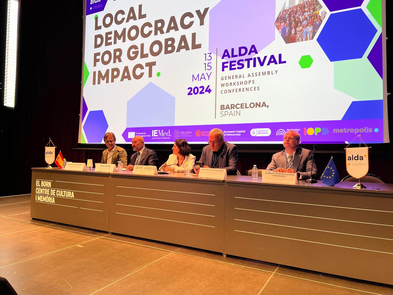 Lema "Democracia Local para un Impacto Global"